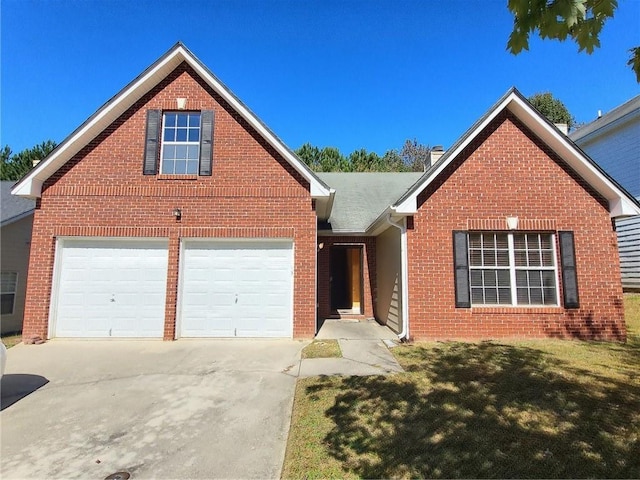 front of property with a front yard and a garage