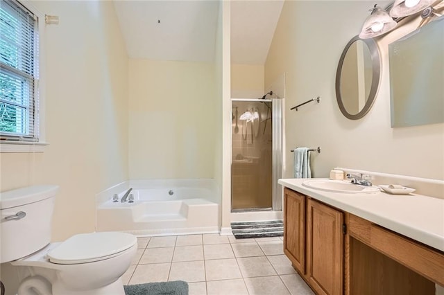 full bathroom with tile patterned flooring, toilet, a shower stall, vanity, and lofted ceiling