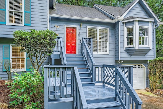 property entrance with roof with shingles