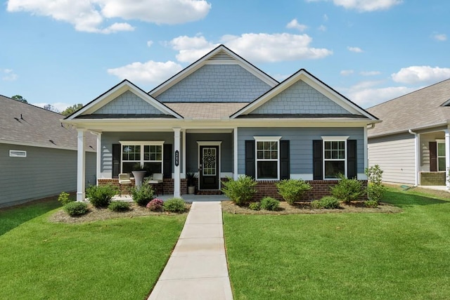 craftsman house with a porch and a front yard