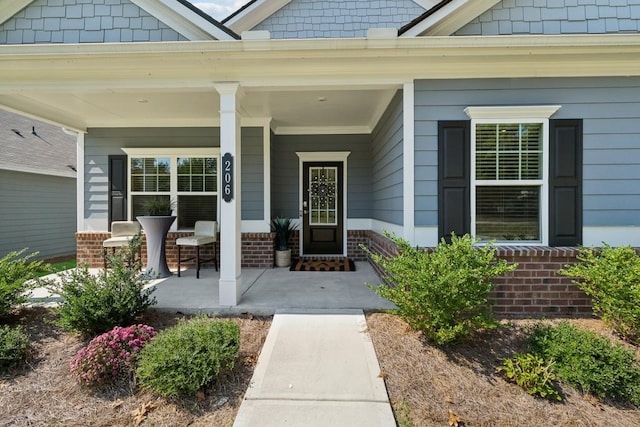 property entrance featuring covered porch