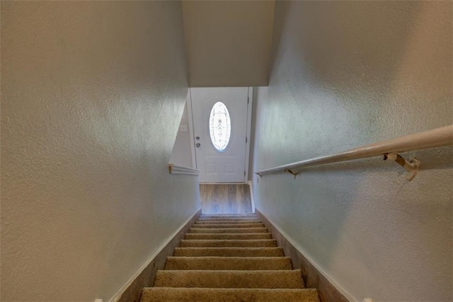 302 Atlanta Ave, Atlanta, GA 30315 - stairs with wood finished floors, a textured wall, and baseboards