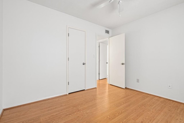 unfurnished bedroom featuring ceiling fan and light wood-type flooring