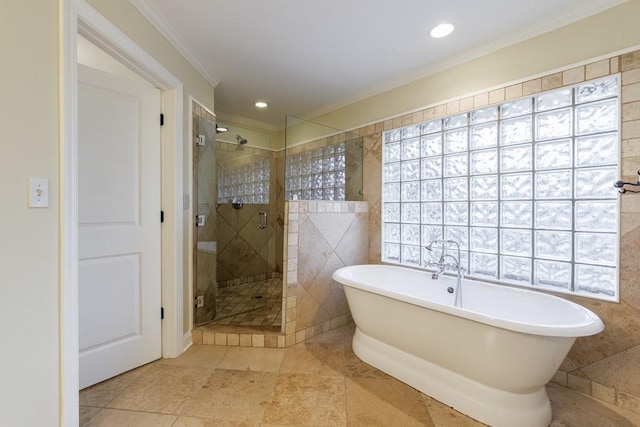 bathroom featuring tile walls, crown molding, separate shower and tub, and a healthy amount of sunlight