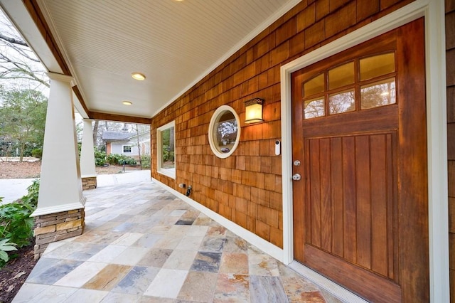 doorway to property with a porch