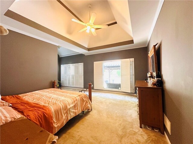 1739 Praters Pt, Dacula, GA 30019 - bedroom with a raised ceiling, light carpet, crown molding, a ceiling fan, and baseboards