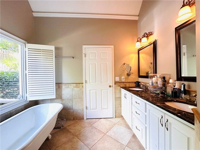 1739 Praters Pt, Dacula, GA 30019 - full bathroom with tile walls, crown molding, tile patterned floors, a soaking tub, and wainscoting