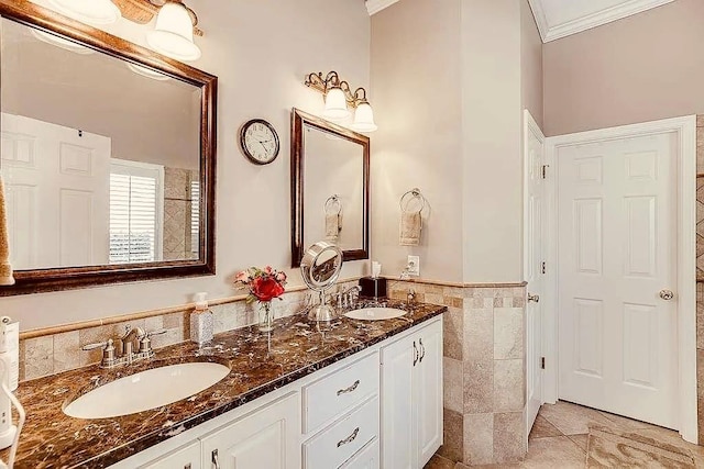 1739 Praters Pt, Dacula, GA 30019 - full bath with ornamental molding, tile walls, double vanity, tile patterned flooring, and a wainscoted wall