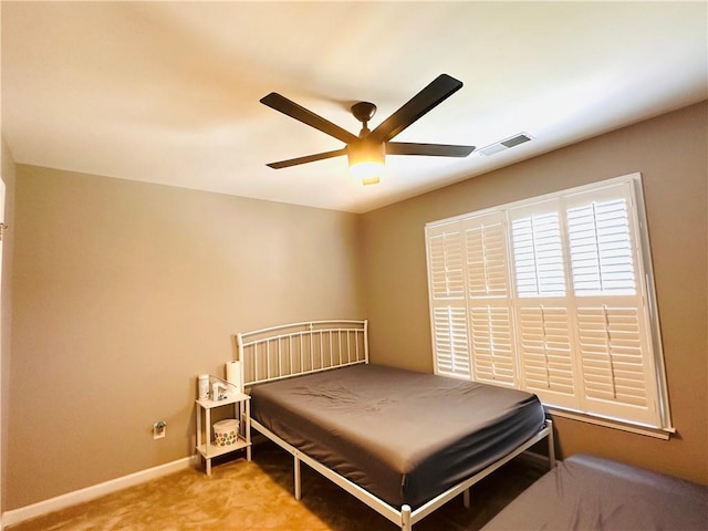 1739 Praters Pt, Dacula, GA 30019 - carpeted bedroom with baseboards and ceiling fan
