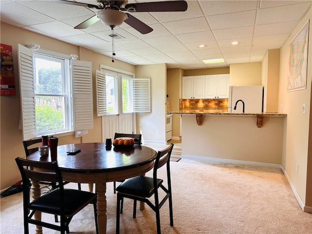 1739 Praters Pt, Dacula, GA 30019 - dining area featuring a paneled ceiling, light colored carpet, a ceiling fan, baseboards, and recessed lighting