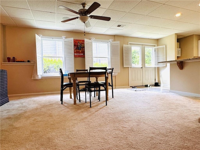 1739 Praters Pt, Dacula, GA 30019 - dining area featuring baseboards, a drop ceiling, carpet, and a ceiling fan