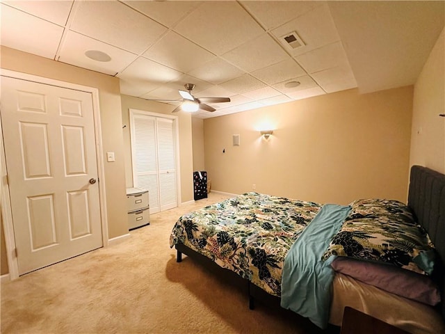 1739 Praters Pt, Dacula, GA 30019 - bedroom with light carpet, a drop ceiling, a closet, a ceiling fan, and baseboards