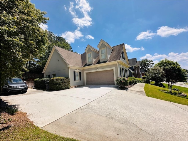 1739 Praters Pt, Dacula, GA 30019 - view of front of property featuring concrete driveway, stucco siding, a garage, roof with shingles, and fence