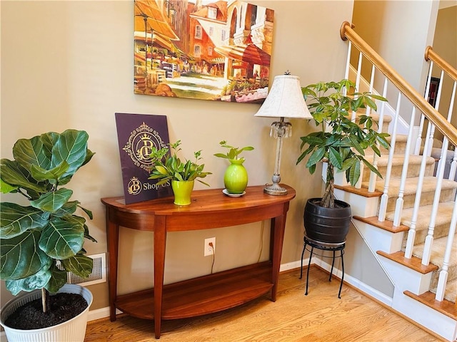 1739 Praters Pt, Dacula, GA 30019 - bar featuring wood finished floors, stairs, and baseboards