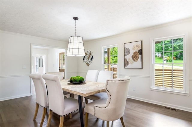 2015 Clipper Straits, Snellville, GA 30078 - dining area featuring a textured ceiling, dark wood-style flooring, and ornamental molding
