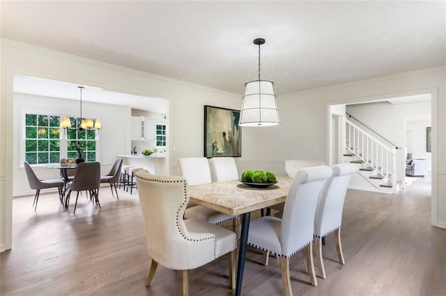 2015 Clipper Straits, Snellville, GA 30078 - dining room with wood finished floors, ornamental molding, stairs, and a chandelier