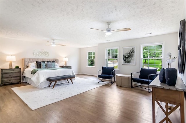 2015 Clipper Straits, Snellville, GA 30078 - bedroom with wood finished floors, a textured ceiling, and a ceiling fan