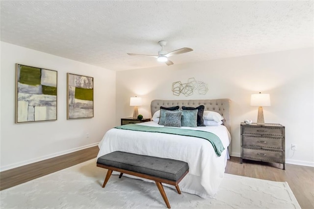 2015 Clipper Straits, Snellville, GA 30078 - bedroom featuring a textured ceiling, wood finished floors, and a ceiling fan