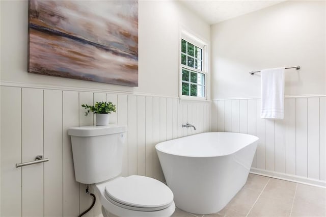 2015 Clipper Straits, Snellville, GA 30078 - full bathroom with a soaking tub, a wainscoted wall, and tile patterned floors