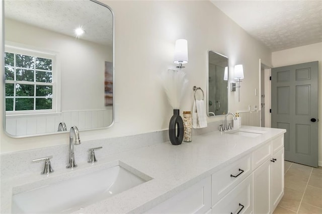 2015 Clipper Straits, Snellville, GA 30078 - full bath featuring a textured ceiling, double vanity, and tile patterned floors