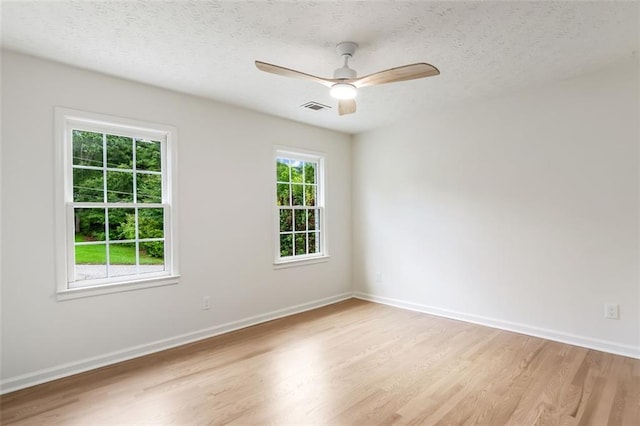 2015 Clipper Straits, Snellville, GA 30078 - empty room with light wood-style flooring, ceiling fan, and a textured ceiling