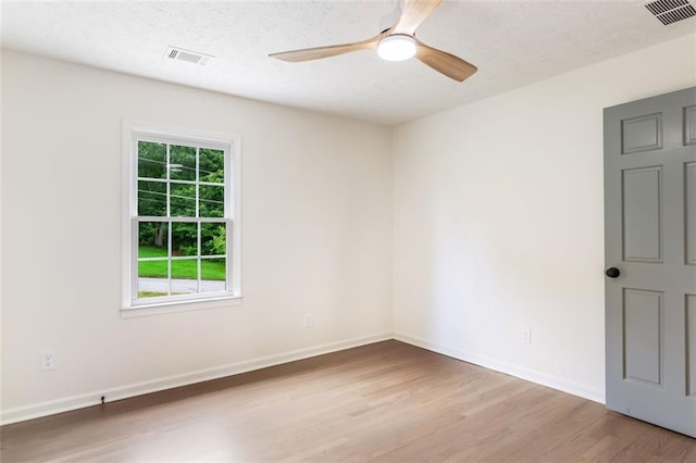 2015 Clipper Straits, Snellville, GA 30078 - empty room with wood finished floors, a ceiling fan, and a textured ceiling