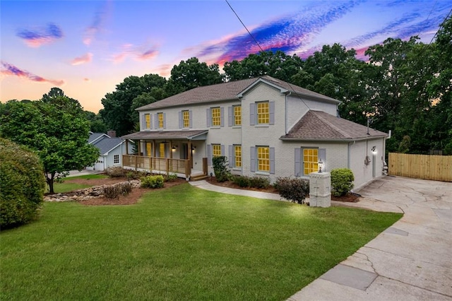 2015 Clipper Straits, Snellville, GA 30078 - colonial inspired home featuring a porch, concrete driveway, a garage, and roof with shingles