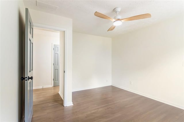 2015 Clipper Straits, Snellville, GA 30078 - unfurnished room featuring wood finished floors, a ceiling fan, and a textured ceiling