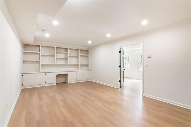 2015 Clipper Straits, Snellville, GA 30078 - unfurnished living room featuring built in desk, light wood finished floors, and recessed lighting
