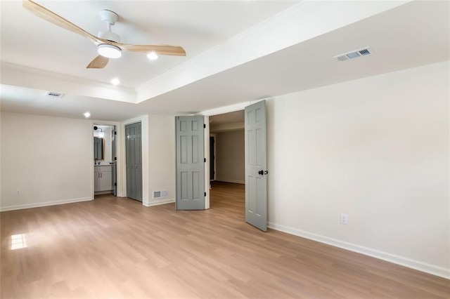 2015 Clipper Straits, Snellville, GA 30078 - unfurnished bedroom with light wood finished floors, a raised ceiling, ornamental molding, connected bathroom, and ceiling fan