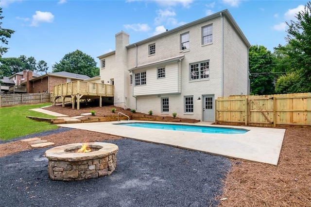 2015 Clipper Straits, Snellville, GA 30078 - view of pool featuring a deck, a patio, an outdoor fire pit, and a gate