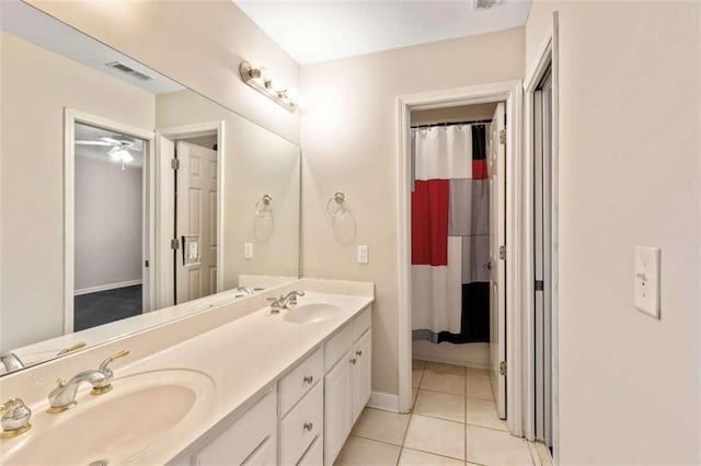 full bathroom featuring tile patterned flooring, visible vents, double vanity, and a sink