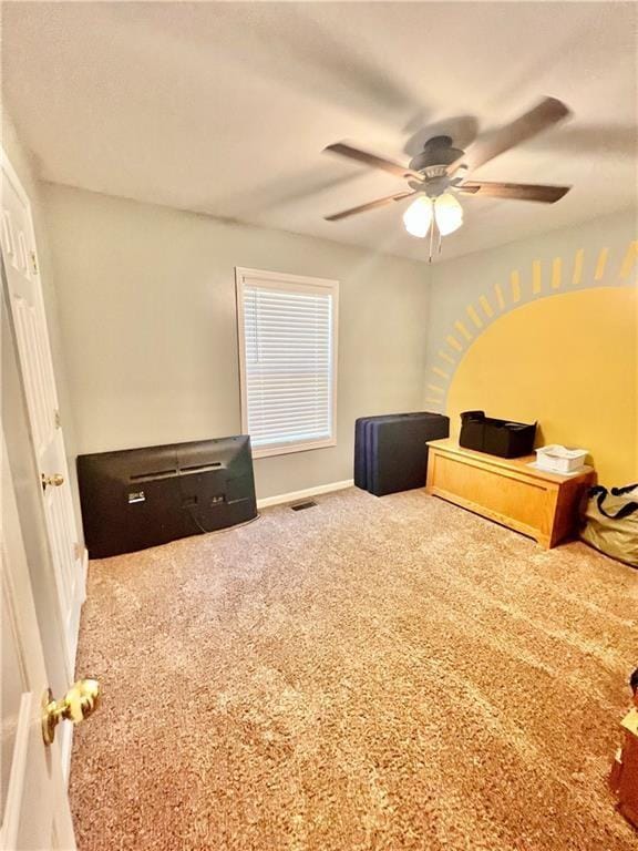 bedroom featuring ceiling fan, carpet flooring, visible vents, and baseboards