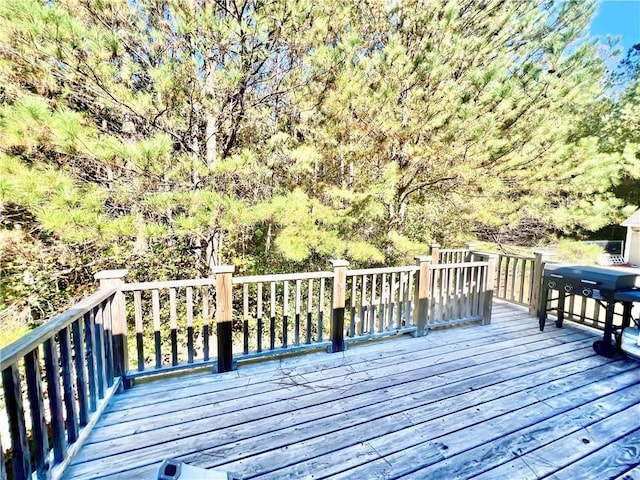 wooden deck with grilling area