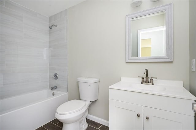 full bathroom featuring vanity, toilet, baseboards, and shower / washtub combination