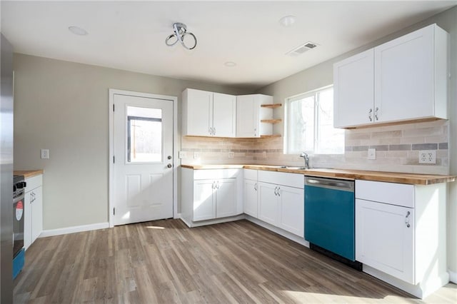 kitchen with visible vents, dishwasher, light wood-type flooring, white cabinetry, and wood counters