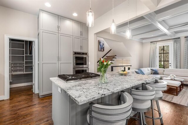 540 Woodall Ave NE, Atlanta, GA 30306 - kitchen with stainless steel appliances, open floor plan, recessed lighting, a kitchen island, and dark wood-type flooring