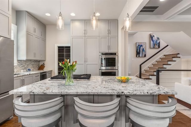 540 Woodall Ave NE, Atlanta, GA 30306 - kitchen featuring recessed lighting, dark wood finished floors, appliances with stainless steel finishes, and gray cabinets