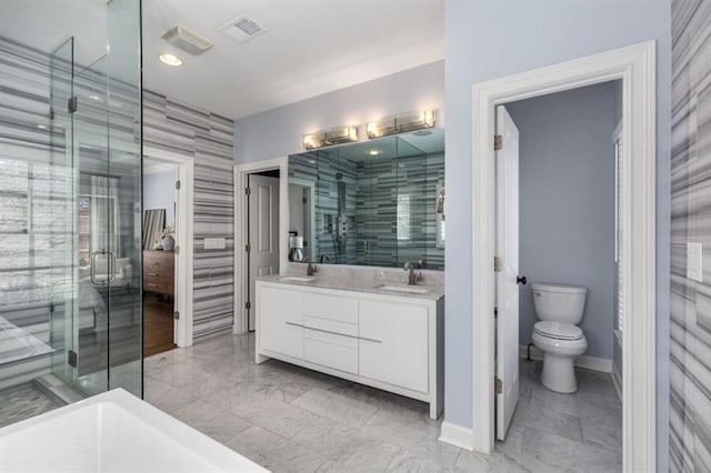 540 Woodall Ave NE, Atlanta, GA 30306 - full bath featuring toilet, a sink, double vanity, and a stall shower