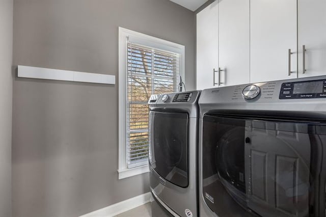 540 Woodall Ave NE, Atlanta, GA 30306 - laundry area with washer and dryer, baseboards, and cabinet space