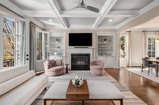 540 Woodall Ave NE, Atlanta, GA 30306 - living room featuring a glass covered fireplace, a ceiling fan, wood finished floors, and coffered ceiling