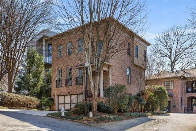 540 Woodall Ave NE, Atlanta, GA 30306 - view of property with an attached garage and driveway