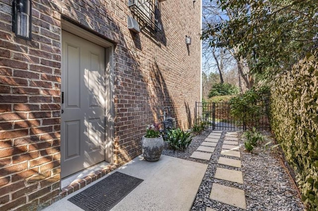 540 Woodall Ave NE, Atlanta, GA 30306 - view of property exterior with brick siding, fence, and a gate