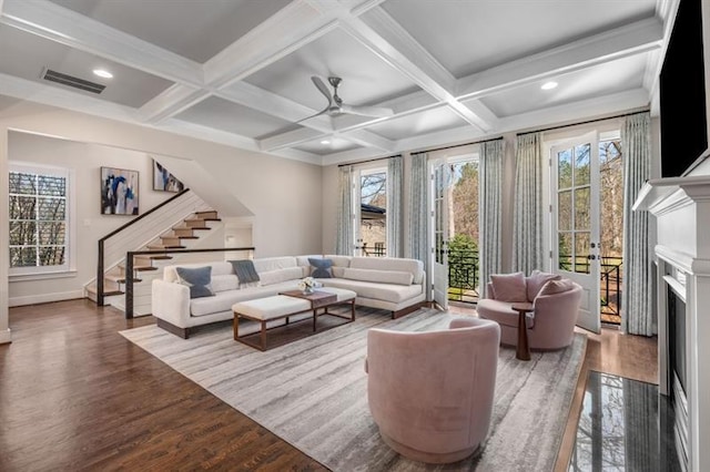 540 Woodall Ave NE, Atlanta, GA 30306 - living room featuring stairs, wood finished floors, plenty of natural light, a fireplace with flush hearth, and visible vents
