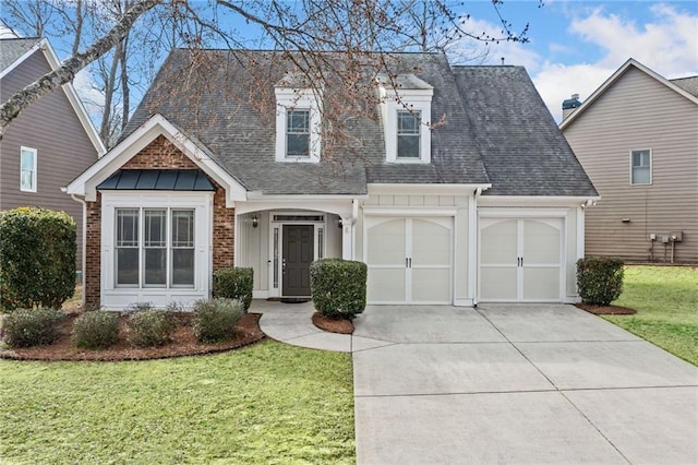 view of front of property with a garage, concrete driveway, roof with shingles, a front lawn, and brick siding