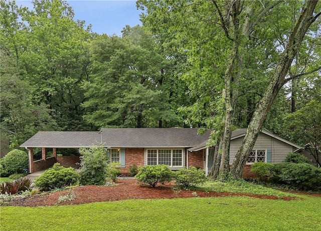 1215 Vista Leaf Dr, Decatur, GA 30033 - view of front of home featuring brick siding, a front yard, and a carport