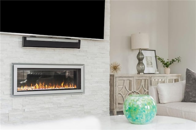 room details featuring a stone fireplace