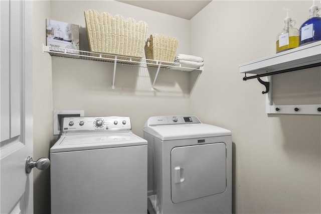 washroom with washer and clothes dryer