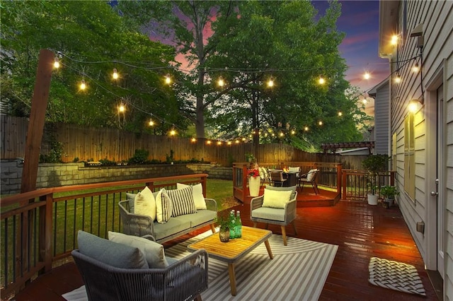 deck featuring outdoor lounge area, a fenced backyard, and outdoor dining area