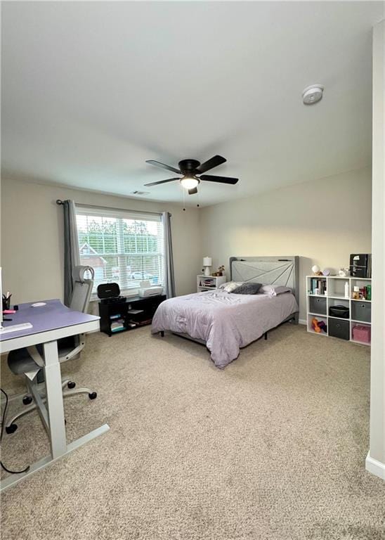 bedroom with carpet floors, ceiling fan, and baseboards